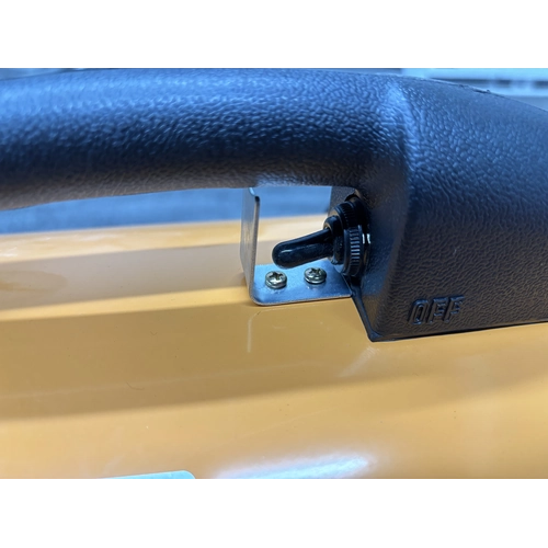 Close-up of the black carry handle and its metal mounting bracket on the blower