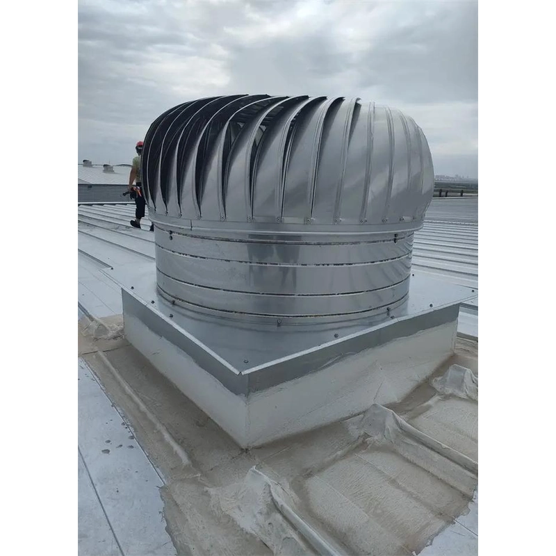 Roof turbine ventilator installed on a raised base on a factory metal roof