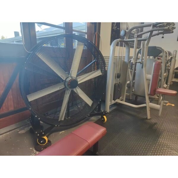 Large mobile industrial fan beside gym equipment