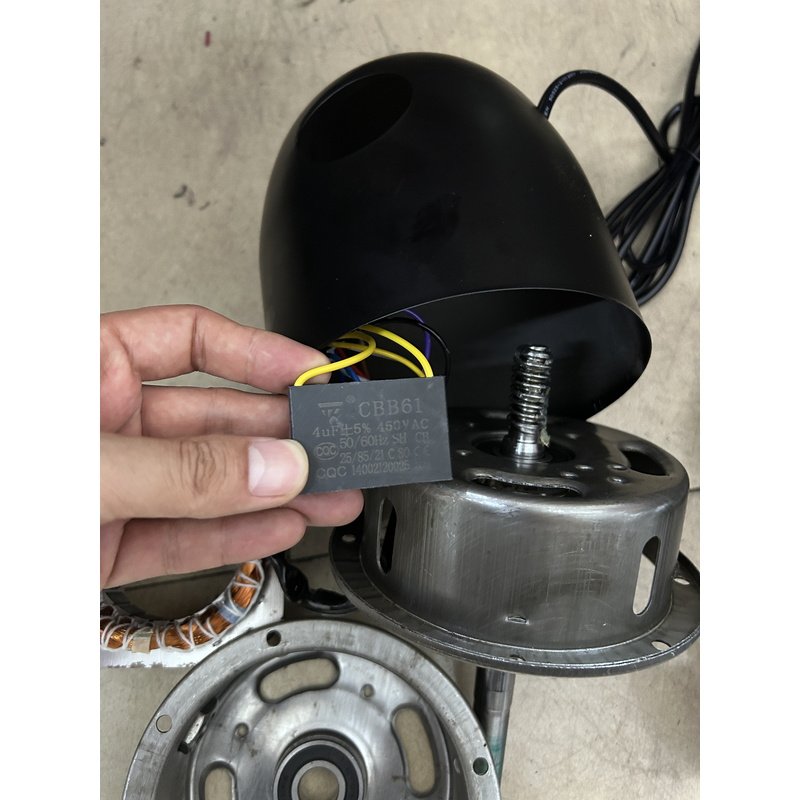 Capacitor fitted inside the industrial fan motor housing