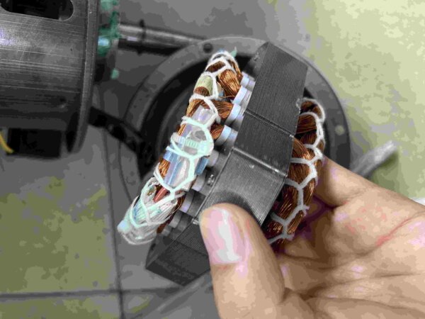 Thermal protection sensor positioned in the industrial fan motor windings