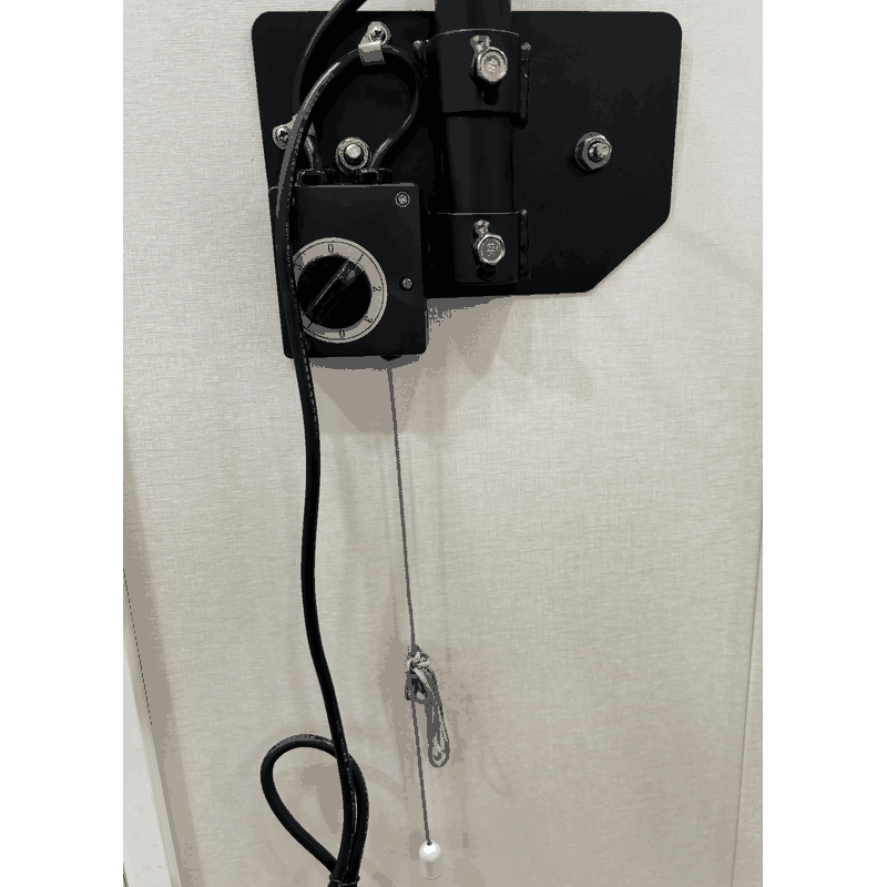 Pull-cord control below the industrial wall fan mounting assembly